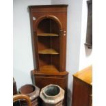 A Yew Wood Double Corner Cupboard, with a dentil cornice, two open shelves, base with a cupboard