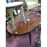 A Modern Mahogany Oval Topped Extending Dining Table.
