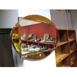 A Circa 1920's Bevelled Rectangular Wall Mirror, with amber tinted, segmented, oval surround.