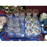 A Suite of Table Glassware, including wines and brandy balloons, gilt edged with machine engraved