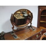 A 1920's Oak Framed Oval Dressing Table Mirror, with shaped supports.