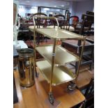 A 1960's Kitsch Style Gold Tea Trolley, with three detachable trays, marked "Woodmet Product",