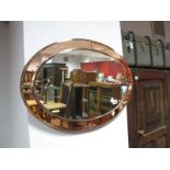 A Circa 1920's Oval Bevelled Wall Mirror, with segmented pink glass surround.