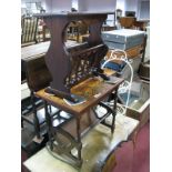 A Mahogany Magazine Rack, one other with printed globe map and a wrought iron two tier rack. (3)