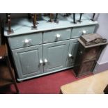 A Modern Painted Pine Sideboard, with three drawers and cupboard doors, on bun feet.