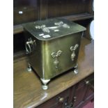An Early XX Century Brass Coal Box, hinged lid with swag decoration, twin loop carrying handles on