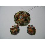 A Large Costume Jewellery Brooch, in oranges, greens and brown, together with matching clip