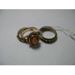 A 9ct Gold Single Stone Dress Ring, oval collet set, together with a 9ct gold five stone ring and