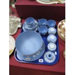 Wedgwood Blue Jasperware Fruit Bowl, plate, twelve piece tea service, trinket pots, candlestick:-