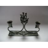 A Taper Stick Holder, of scroll design with central Viking ship, stamped "Holland", together with
