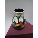 A Moorcroft Pottery Vase in the  "Ayin Flowers in Frost" Design, tubelined and decorated with