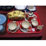 Art Deco Yellow and Silvered Teapot, in the form of a sports car, and a Wade 1930's tea for two set,