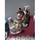 A XIX Century Staffordshire Flatback Figure Group, of two musicians and a dog, together with another