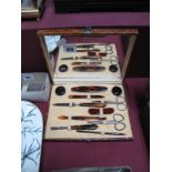 A Lady's Manicure Set, fitted in rectangular case with mirrored lid, complete with scissors,