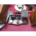 Early XX Century Brass Postal Scales and Weights, on mahogany stand.