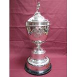 A Large Plated Lidded Trophy Cup, of tapering form, with applied detail, raised on pedestal base