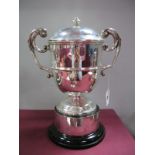 A Hallmarked Silver Twin Handled Lidded Trophy Cup, marks rubbed, of plain circular form, between