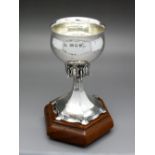 Omar Ramsden; A Hallmarked Silver Miniature Cup, London 1936, the circular hammered bowl supported