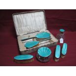 A Turquoise Enamel on Silver Deposit Part Dressing Table Set, comprising hair brush and hand