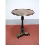 An Early XIX Century Rosewood Pedestal Table, the circular tray top on turned pedestal with