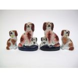 A Pair of XIX Century Staffordshire Pottery Spaniel Figure Groups, with red and black ears, on