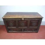 A Late XVII Century Joined Oak Blanket Box, with carved frieze over front with three carved panels