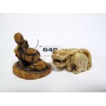 A Late XIX Century Japanese Carved Ivory Netsuke, as a lion dog, 1.9cms high; Another, a walrus