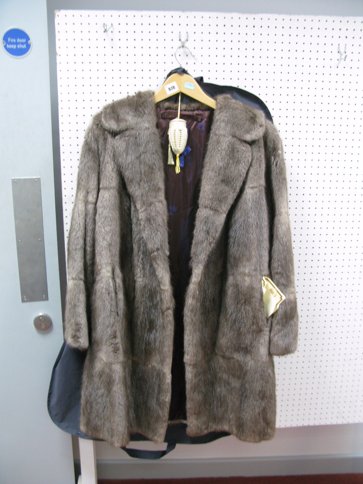 A Dyed Flank Musquash Wrap Coat, Three-quarter length, in grey, with original purchase invoice  (
