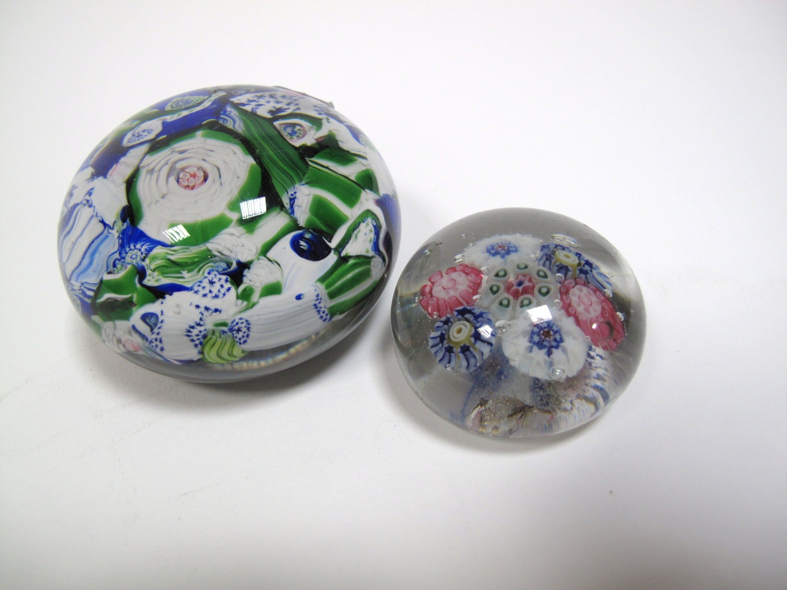 A XIX Century Scrambled Millefiore Paperweight, with primarily blue and green canes, 6.4cms