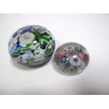 A XIX Century Scrambled Millefiore Paperweight, with primarily blue and green canes, 6.4cms