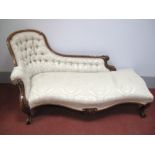 A Mid XIX Century Walnut Chaise Longue, with a shaped back and serpentine shaped front rail, on