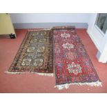 A Mid XX Century Afghan Bokhara Style Rug, centrally with four pairs of elephant pad guls, on a