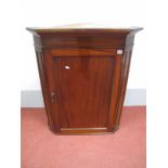 A XIX Century Mahogany Flat Front Corner Cupboard, with stepped cornice, panelled door and two