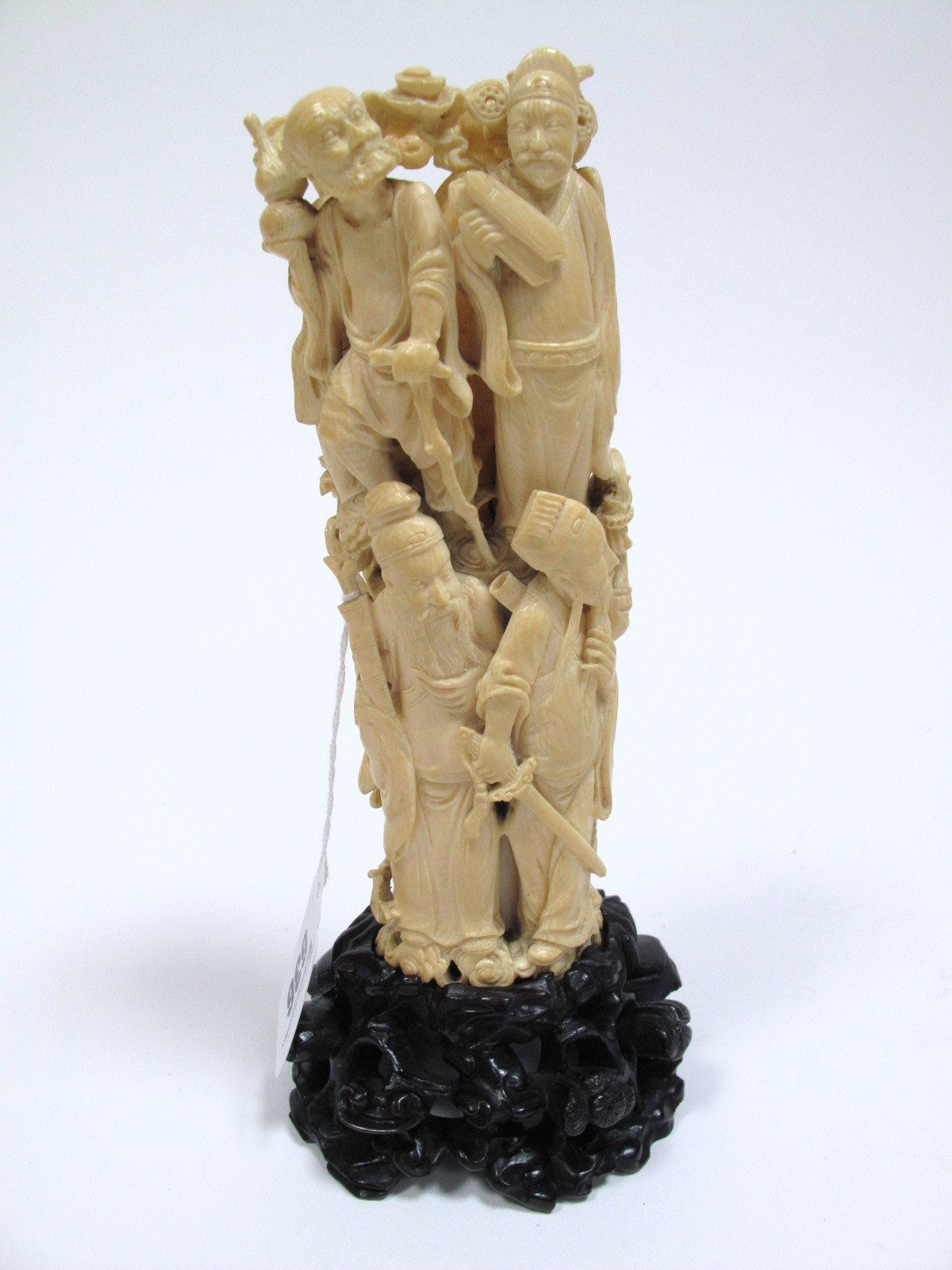 A Late XIX Century Chinese Carved Ivory One Piece Tusk Group, as a column of the eight Immortals