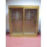 An Early - Mid XX Century Light Oak Outfitter's Shop Display Cabinet, bearing makers label "Dudley &