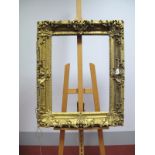 An XVIII Century Carved Giltwood Picture Frame, rectangular aperture size 67 x 50.5cms.