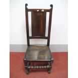 A Late XVII Century Joined Oak High Back Chair, with panelled back and solid seat, on bobbin and