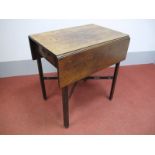 An XVIII Century Mahogany Pembroke Table, with leaves and single drawer, on chamfered legs united by