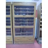 An Early - Mid XX Century Light Oak Haberdashery Shop Display Cabinets, with lift up glass doors,