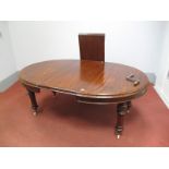 A Mid XIX Century Mahogany Oval Dining Table, on turned and reeded legs with two additional