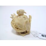 A Late XIX Century Japanese Carved Ivory Box and Cover, as a pomegranate surmounted by a small