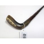A Sunday Golf Walking Stick, the horn handle as a golfing wood with bone insert to the sole, gilt