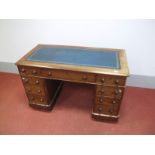 A XIX Century Mahogany Pedestal Desk, the crossbanded top with blue leather scriver, three top