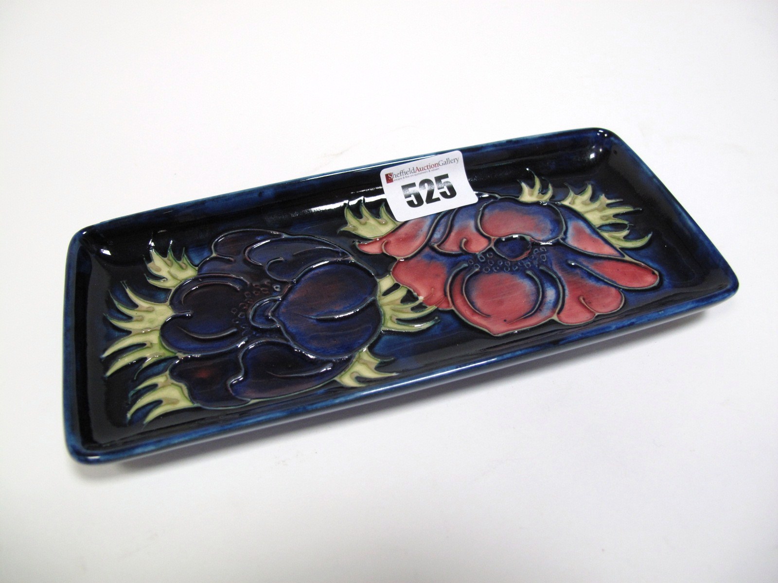 A Moorcroft Pottery Pin Tray, of rectangular form, tubelined and decorated in the Anemone pattern on