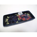 A Moorcroft Pottery Pin Tray, of rectangular form, tubelined and decorated in the Anemone pattern on