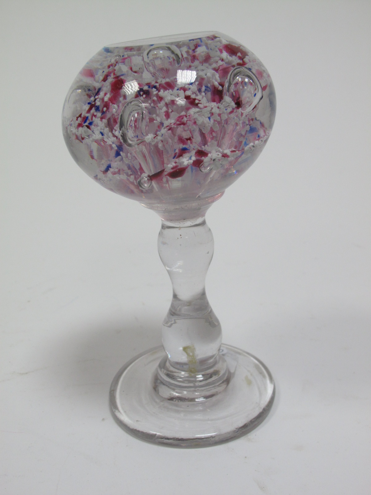 A XIX Century Wig Stand Paperweight, with five elongated bubble inclusions set amongst scattered