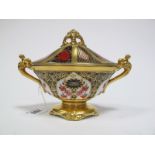 A Royal Crown Derby Bone China Two Handled Pedestal Vase and Cover, painted and gilt in the Old