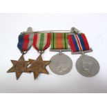 A Set of Four WWII Medals, a Defence Medal, War Medal, Italy Star and 1939-45 Star, all with