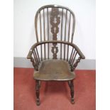 A XIX Century Ash and Elm Windsor Chair, with a hooped back, pierced splats, on turned legs united
