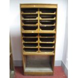 An Early - Mid XX Century Light Oak Haberdashery Shop Cabinet, with sixteen drawers, on plinth base,